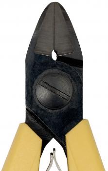 The image shows a pair of pliers with a pointed, sharp cutting surface. The handles are yellow and the head is made of black metal. In the center, there is a circular area with a notch.
