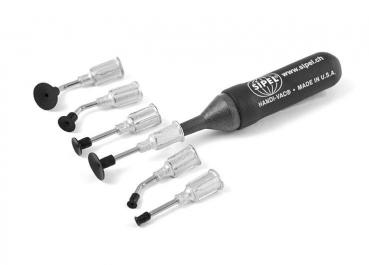 The image shows a black tool with a rubberized grip area and several transparent attachments in various shapes. These are visible on one side and partly curved.