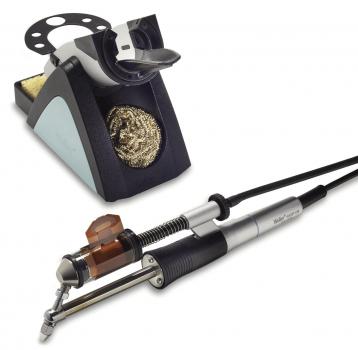 The image displays a tattoo machine with a metal grip and a cable connected to a colored base. The base features a round cutout and a dark color.