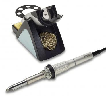 The image shows a soldering iron with a gray handle and a pointed soldering tip. Next to it is a soldering iron stand with a metal cleaning spiral and a sponge area.