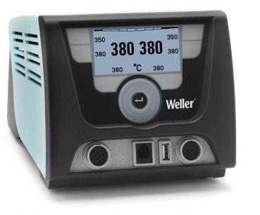 The image shows a digital temperature control device in a compact casing. It has a large display with temperature readings, three knobs, and ports on the front.