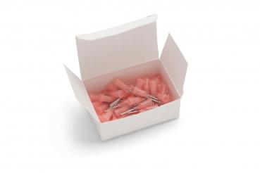 An open, white box contains several small, pink parts with metallic tips. The parts appear to be accessories or mounts, which are chaotically arranged in the box.