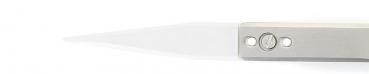 The image shows a narrow, pointed knife with a transparent blade and a silver handle. The handle has two small holes and a round indentation in the middle.
