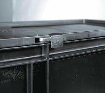 The image displays a black plastic container with a flat lid. A small metal clasp is visible on the side. The container features a sturdy, rectangular design.