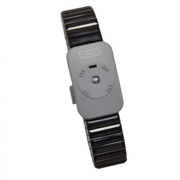The image shows a gray bracelet with a wide, flexible band. In the center, there is a rectangular case featuring a round, raised button and simple markings.