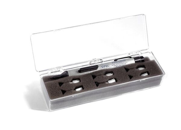 The image shows a transparent storage box. Inside, there are several colored pens securely embedded in gray foam. The box has a lid and appears neat.