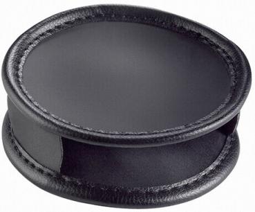 The image shows a round, flat object in black plastic and leather. It has slightly raised edges and a smooth surface, conveying a modern, elegant impression.