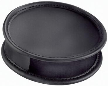 The image shows a black, oval object with a smooth surface. It has a slightly raised edge and is thin, with a rounded rim. It appears soft and supple.
