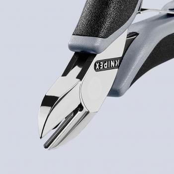 The image displays the precise tip of a pair of pliers with shiny blades and an ergonomic, gray handle. The word "KNIPEX" is printed on the pliers.