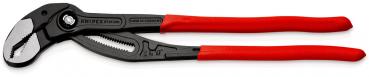 The image shows a black pipe wrench with a red, non-slip grip. The wrench has an adjustable head with serrated edges for gripping pipes and other objects.