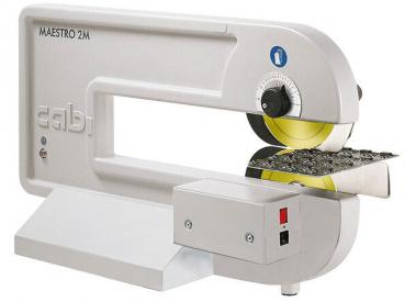 The image shows a machine labeling device in a modern, sleek design. It is predominantly white with a yellow trim circle and a control panel with switches.
