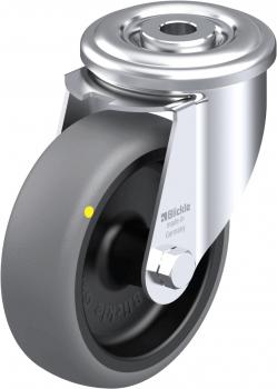 The image shows a gray wheel with a shiny metal frame. In the center, there is a central axle with a small yellow marking. It is a furniture or transport wheel.