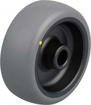 The image shows a gray wheel with a black interior. It has a smooth surface and a hole in the center. Additionally, there is a small yellow dot on the outer surface.