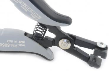 The image shows a gray pair of pliers with an ergonomic handle. It features a spring-loaded mechanism and a sharp blade for cutting. The parts are precisely manufactured and robust.