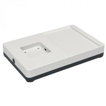 The image displays a rectangular, flat plastic tray. It features a smooth, white surface with a small indentation and an extended area on the right side. The bottom is dark.