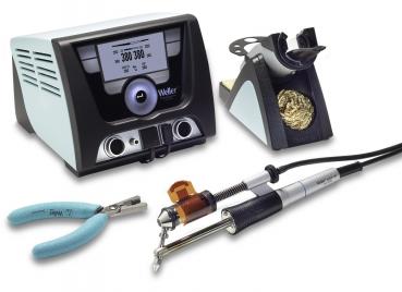The image shows a soldering iron set. It includes a soldering iron with a cable, a soldering station with a digital display, a holder for the soldering iron, and a pair of tweezers.