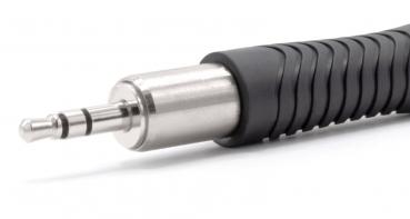The image shows a silver 3.5 mm jack plug with a non-slip, black rubber coating. The plug has three contact strips and is slightly conical in shape.