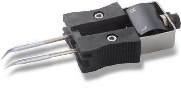 The image shows an interface with two metal probes that look like clamps, and a housing with a rotatable part. The letters 