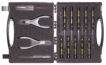 The image shows a toolbox that is open. Inside, there are two pliers and several screwdrivers with black handles and yellow labels. The case has a padded interior.