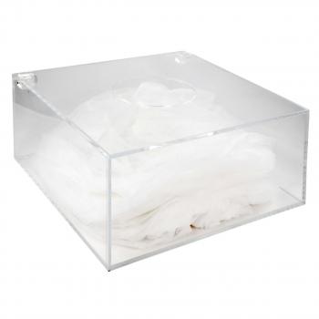 The image shows a transparent rectangular plastic box filled with crumpled white fabrics or cloths. The box has two round holes on the top.