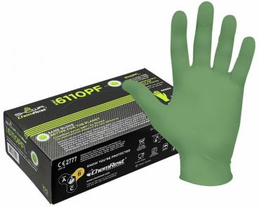 The image shows a green latex disposable glove, half lying on a black package. The packaging features yellow lettering and a hand symbol. It is hygienic and medical.