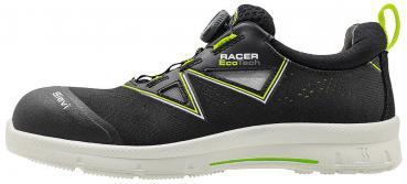 The shoe is black with bright green accents. It has a sporty design, a closed toe area, and a bright, non-slip sole. The closure is via a twist system.