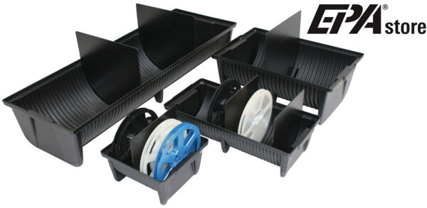 The image shows a gray box with three rollers. One roller is black, one is white, and one is blue. The rollers vary in size and are arranged with the blue one on top.