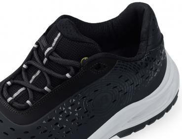 The image shows a black athletic shoe made from breathable material. It has a padded insole and a white outsole. The surface is adorned with geometric patterns.