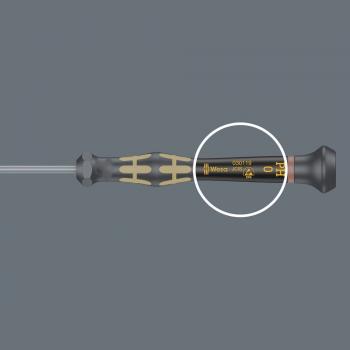The image shows a screwdriver with a black, rubberized handle and gold-colored accents. It has a long, thin blade. Markings and the size '0' can be seen on the handle.