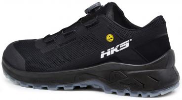The image shows a black sports shoe with a breathable upper. It has a sturdy sole with good grip and a convenient quick-lacing mechanism.