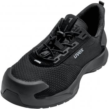 The shoe is a black, sporty sneaker with a breathable mesh upper. It has a cushioned sole and reinforced toe cap for added protection.