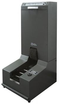 The image shows a sole cleaning machine. It has a large orange handlebar and a gray rectangular base with brushes in the middle for cleaning shoe soles.
