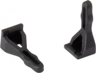 The image shows two black plastic parts. They are sturdy, have angular shapes with a flat base and a vertical, curved structure that is open at the top.