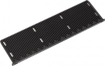 The image shows a black, elongated object with many parallel grooves. It has a smooth surface and device slots or openings at the edges.