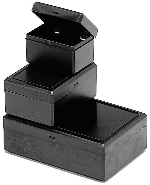 It is a black, rectangular box with a flat lid. The edges are slightly rounded, and a narrow opening at the front allows for the insertion of objects.