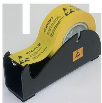 In the picture is a black tape dispenser with a yellow roll of tape. The tape carries warning notices in German, e.g., 