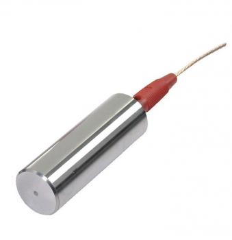 The image shows a cylindrical metal object with a smooth, shiny surface. At the top is a small, round area, and a red cable leads out.