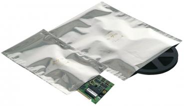 The image displays a small circuit board in the lower left corner, surrounded by two silver foil bags and a black coil on the right side of the picture.