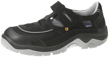 Der Schuh ist schwarz mit grauen Akzenten. Er hat einen Klettverschluss und eine rutschfeste Sohle, ideal für Komfort und Stabilität. Das Obermaterial ist aus leichtem, strapazierfähigem Stoff.