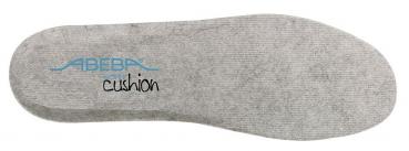 The image shows a gray shoe sole made of flexible material. In the center, the word "cushion" is displayed, and above it is a logo in blue lettering. The surface has a fine, textured texture.