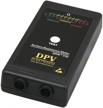 The image displays a black surface resistance meter with a large white button in the center and two sockets at the bottom. Colored scales for resistance values are shown at the top.