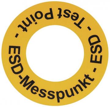 The image shows a yellow, round sticker with black text. The words 