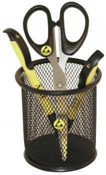 A black wire basket is placed on a surface. Inside are three scissors: two with black handles and one with a yellow handle. The scissors are only partially visible.