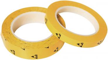 In the image, there are two rolls of yellow tape visible. The tape has black warning symbols indicating danger. The rolls have an inner core made of cardboard.
