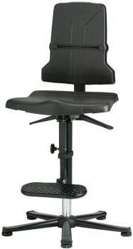 The image shows an adjustable-height, black office chair with a backrest. The seat is lightly padded, and there is a footrest as well as a base plate with five casters.