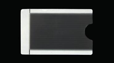 The image shows a rectangular, flat object in black and white. The left side has a continuous white area, while the right side has a recess. The background is black.