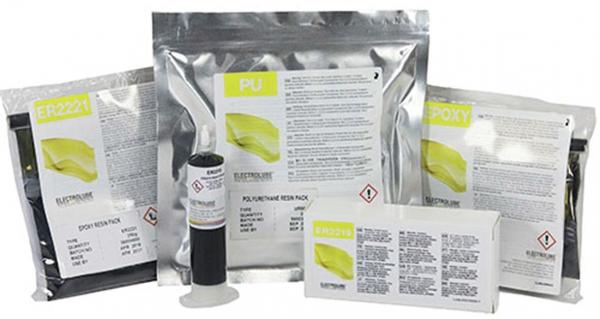 The image displays multiple products in silver packaging with yellow labels. There are various substances or materials, accompanied by a syringe and a white box containing instructions.