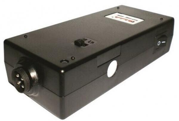 The image shows a long, black casing with various knobs and connectors. It has a smooth surface and appears sturdy, possibly an electrical device.