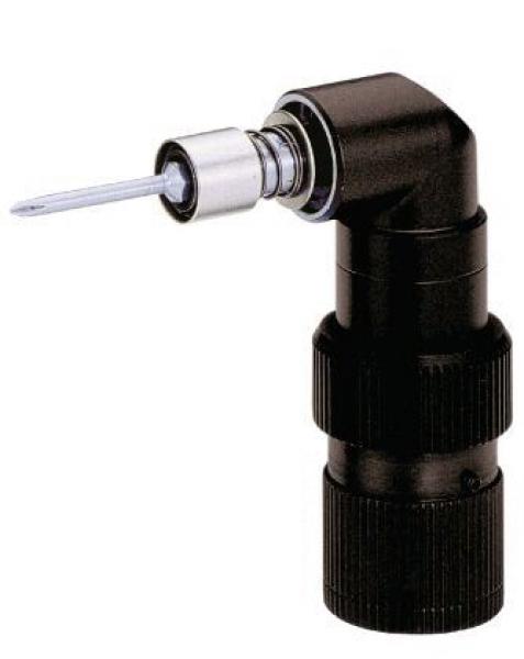 The image shows a black, compact adapter with an angled end. At the top, a silver part is visible, holding a long, thin pin. The adapter has a textured surface.