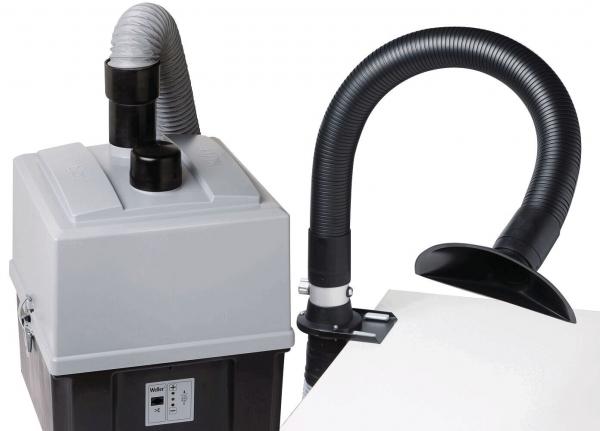 The image displays a gray device with a rounded lid and a hose that curves upward in an arch-like shape. The hose features a wide, open nozzle.